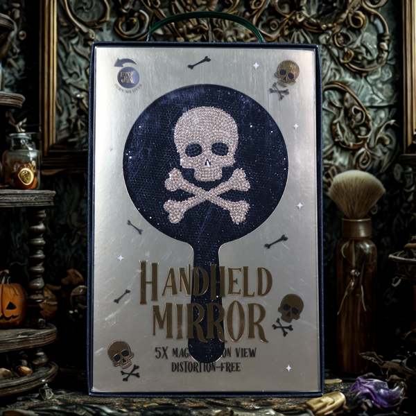 Shine Sparkle & Smile – 5× Magnifying Skull Handheld Mirror (Black & Gold)